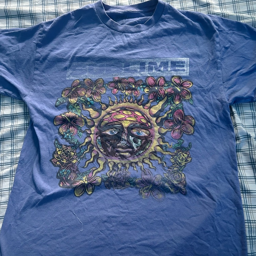 Vibrant Blue T-Shirt with Sun and Floral Design
